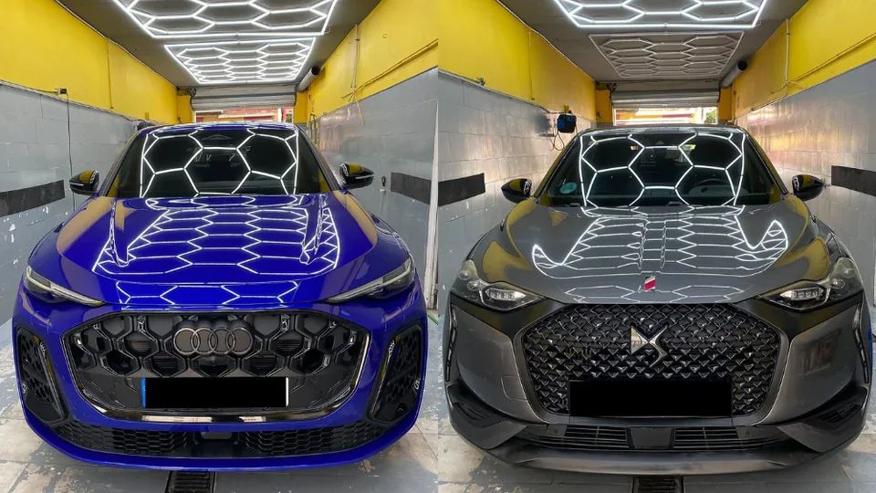 Blue Audi Q5 and grey DS 3 at our car wash in San Pedro de Alcántara, under the hexagonal LED ceiling
